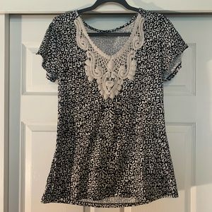Black and white shirt with floral neck
